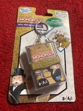 Hasbro Monopoly Mini Keychain Game - Gold and Clear. New